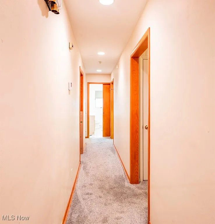Hall featuring carpet floors and recessed lighting