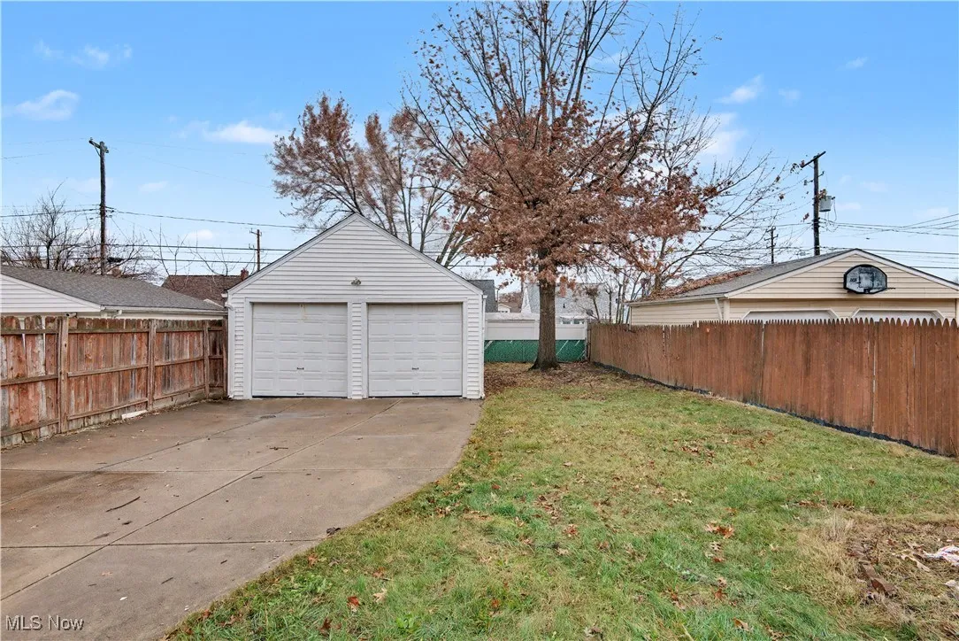 View of yard with an outbuilding and a garage