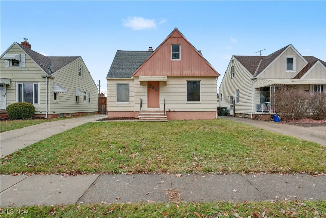 Bungalow-style house featuring a front yard