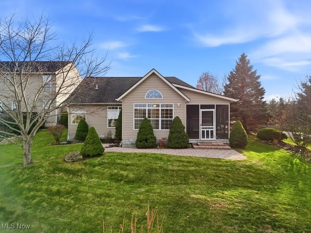 Rear view of home and lawn