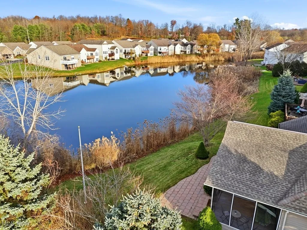 Aerial perspective of suburban area with a large body of water