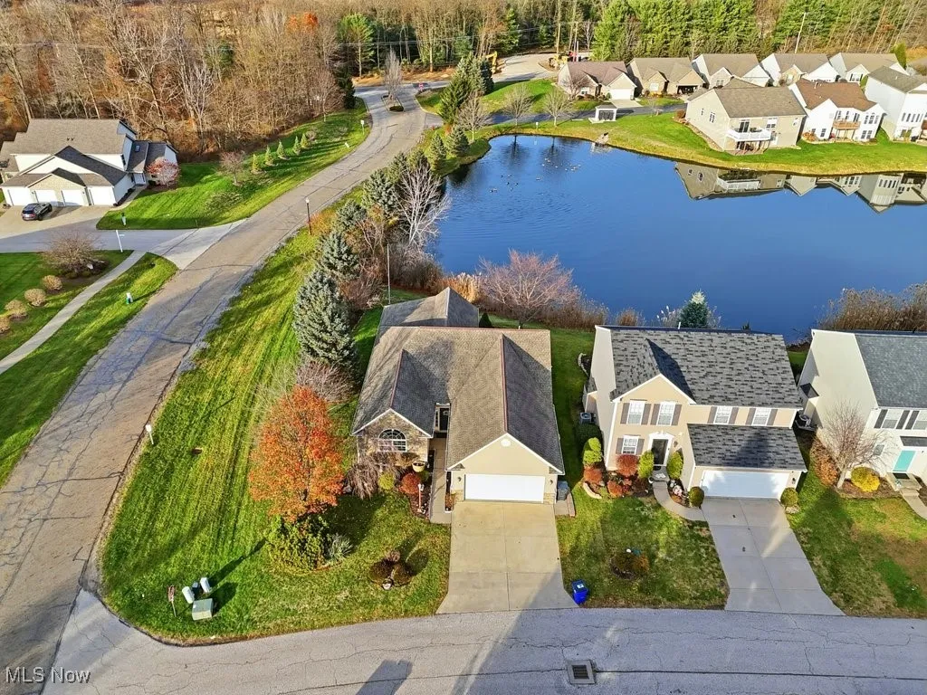 Aerial perspective of suburban area with a large body of water
