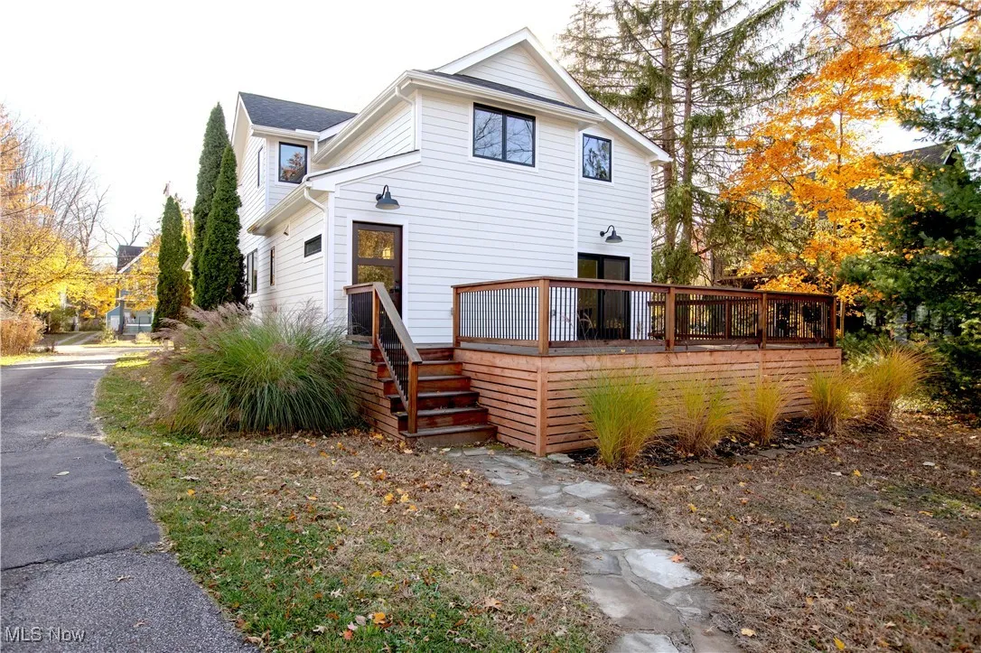 View of front of house with a wooden deck