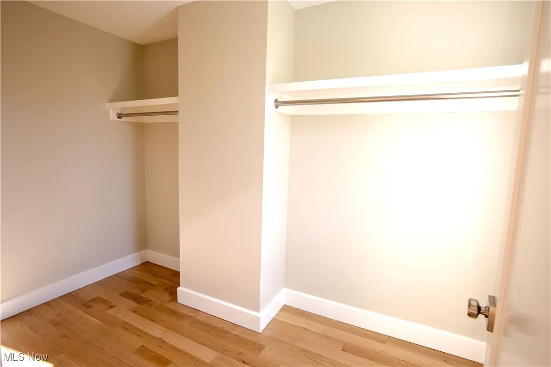 Walk in closet primary bedroom