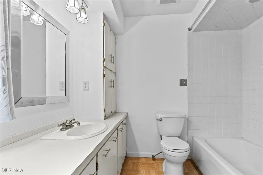 Full bath featuring vanity and tub / shower combination