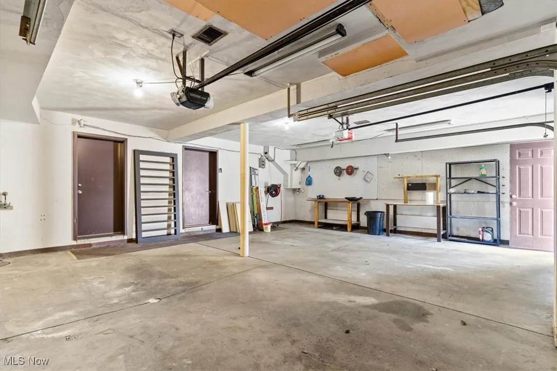 Garage featuring a garage door opener