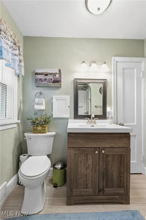 Bathroom featuring vanity and light wood-style floors