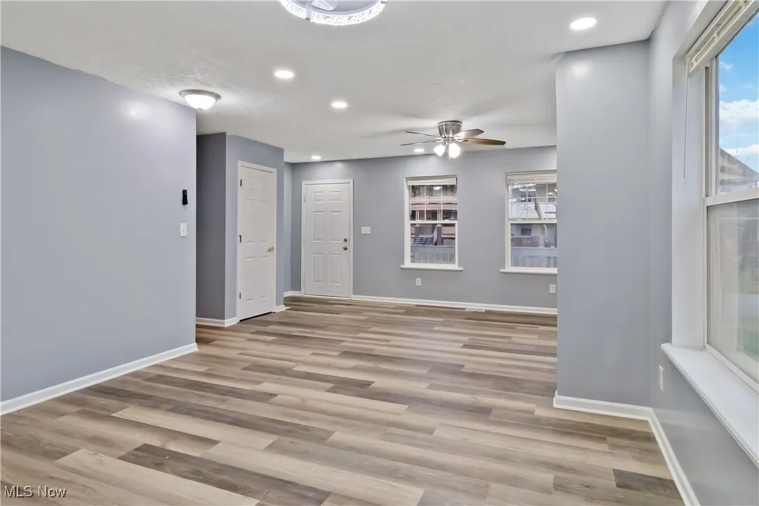 Unfurnished room with light wood-style floors, recessed lighting, and a ceiling fan