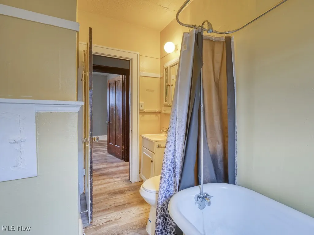 Bathroom featuring vanity, tub