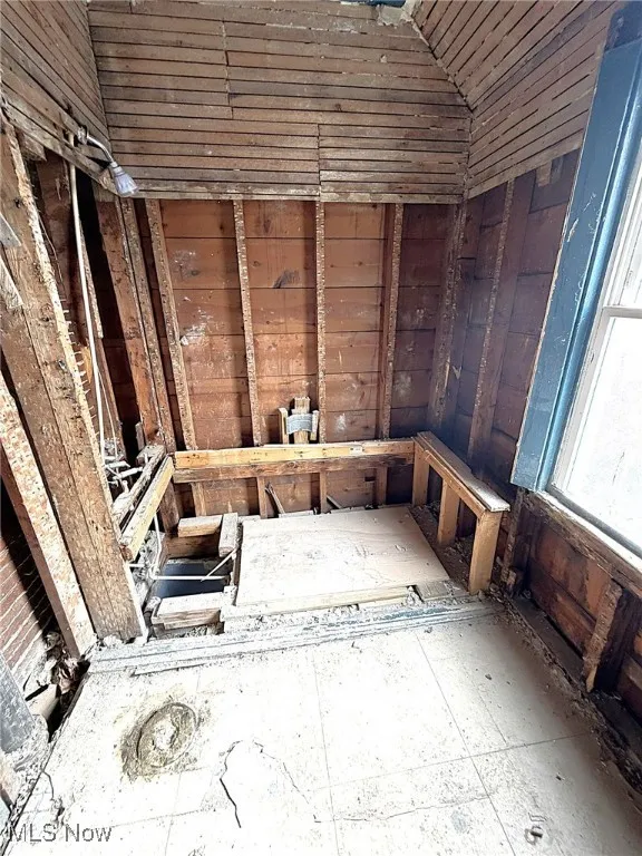 Misc room featuring a sauna and wood walls