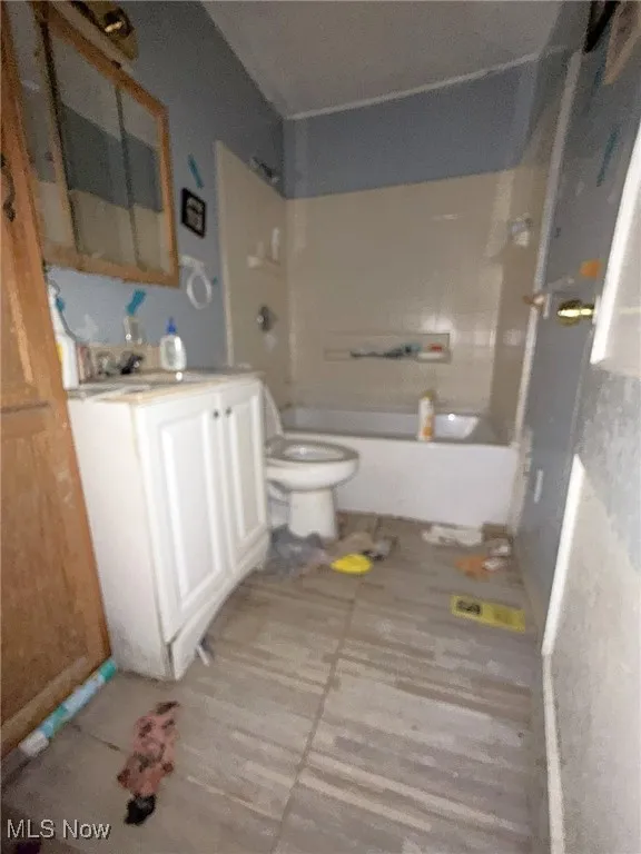 Full bath with vanity and bathtub / shower combination