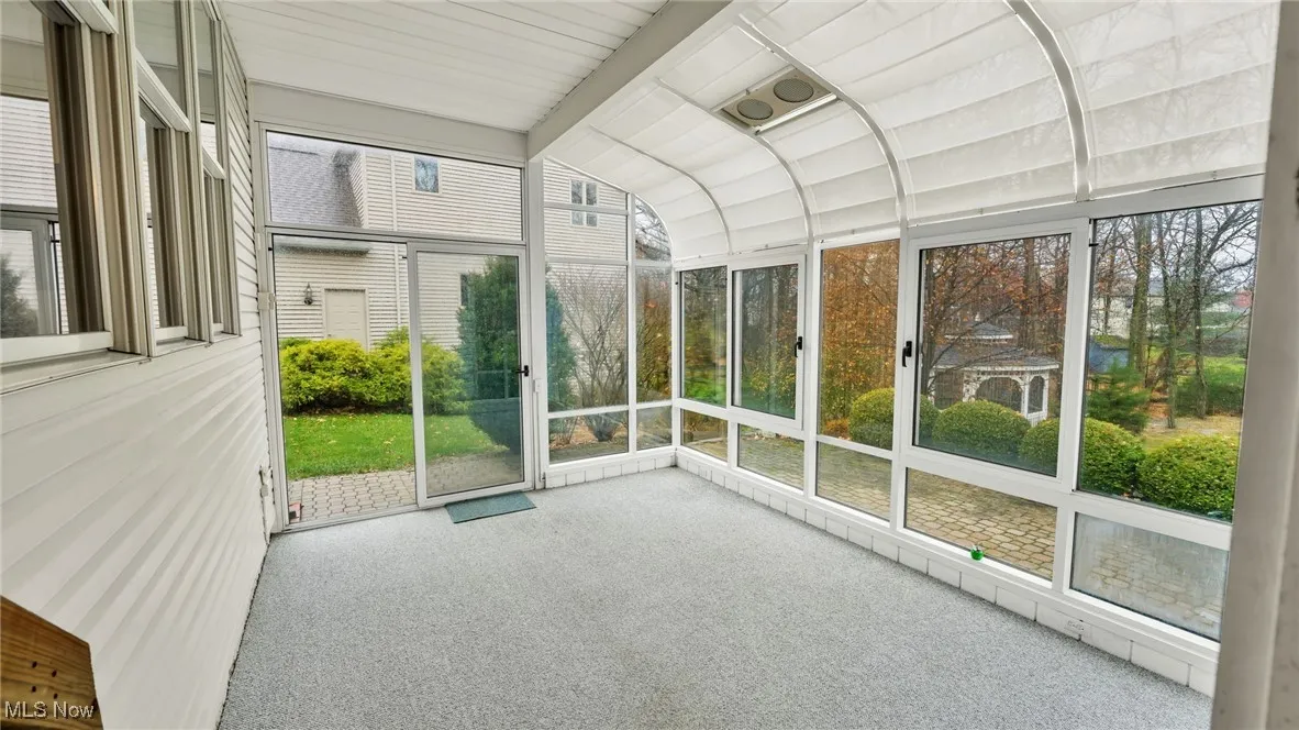 Unfurnished sunroom with healthy amount of natural light