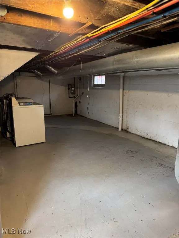 Below grade area featuring washer / dryer