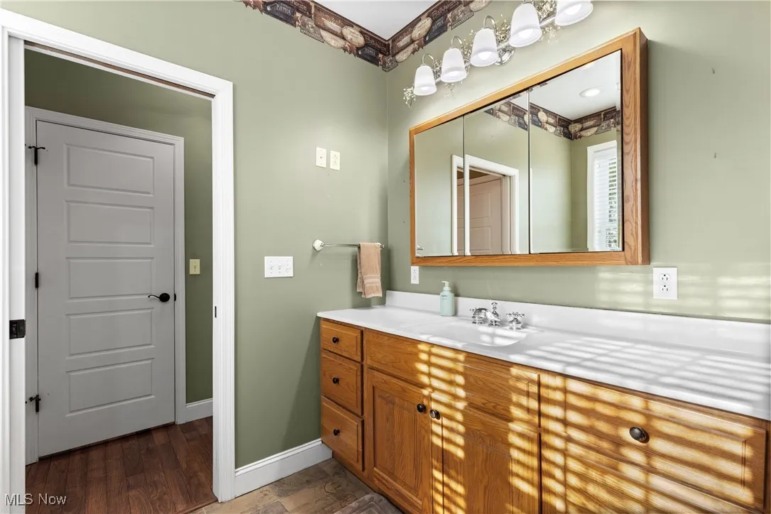 Master bathroom featuring vanity and baseboards