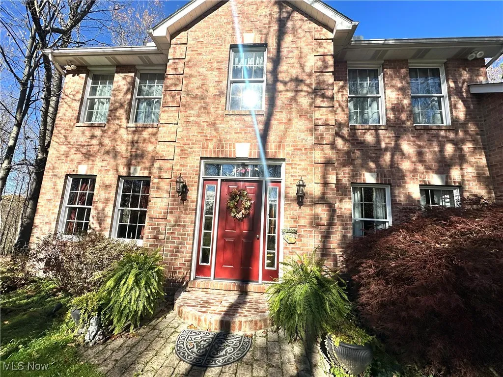 View of front of home with brick siding