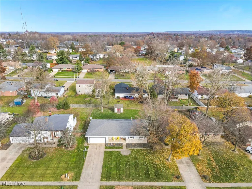 Aerial view showing the home and surrounding neighborhood