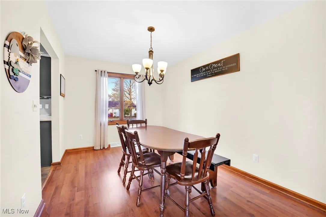 View of the dining room from the living room and window overlooking the backyard