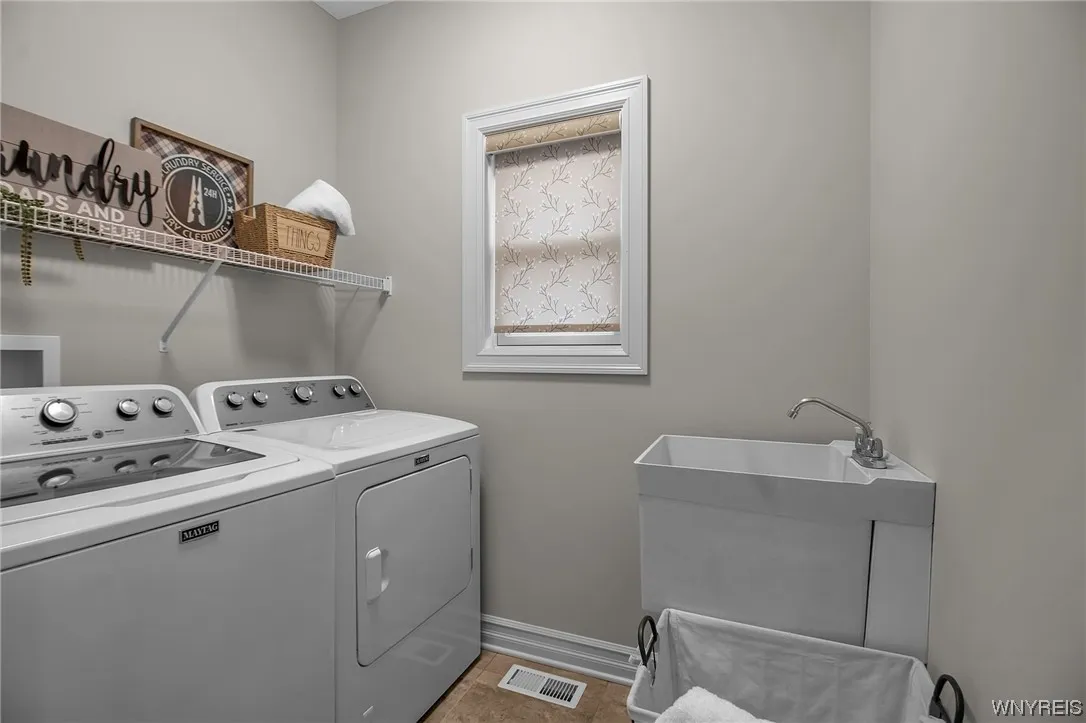 Laundry across from mud room at garage entrance