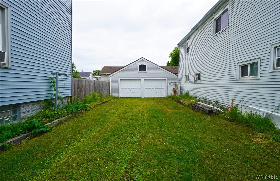 GRASS DRIVE TO GARAGES - OFF STREET PAKING AND BUS STOP  BLOCK AWAY