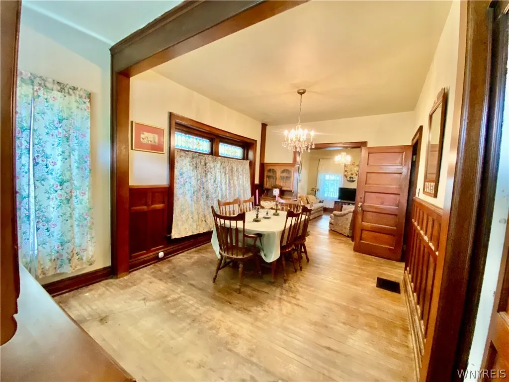 Former butler's panty was opened up to the dining room. Lead glass windows above the replaced dining room windows.