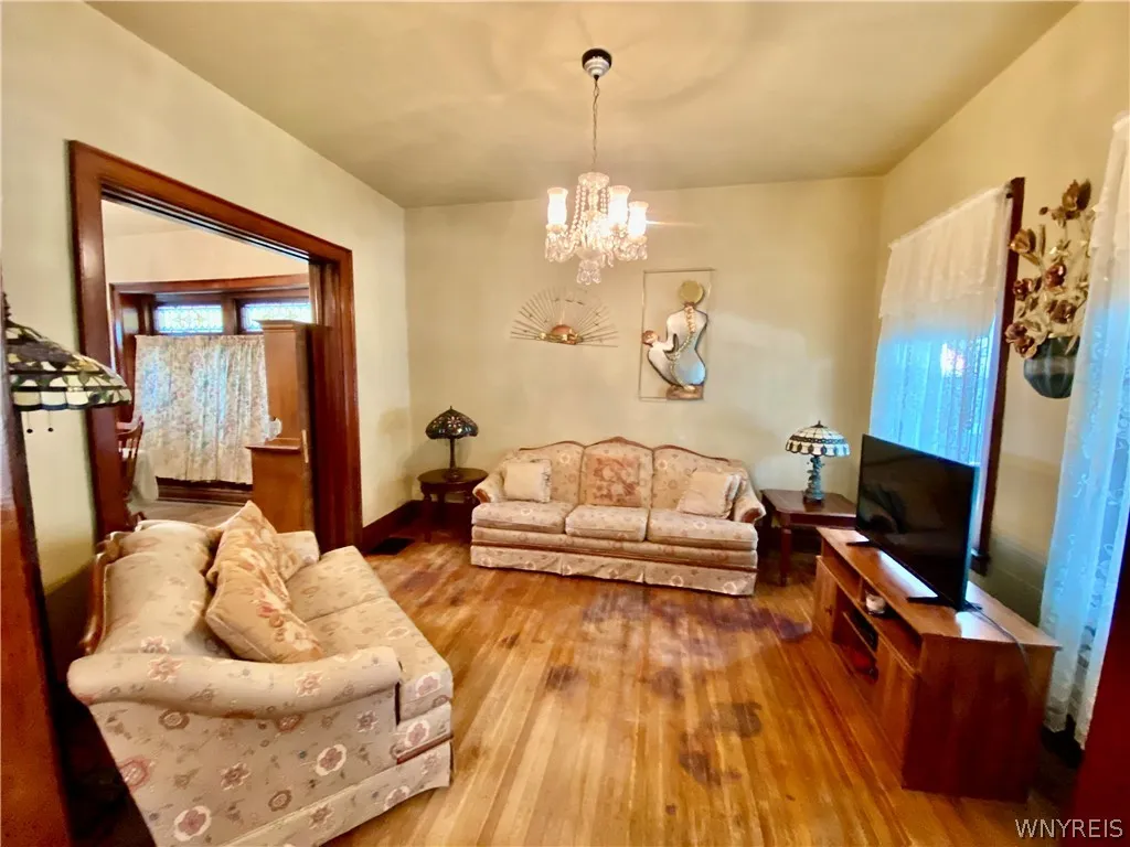 Living room open from foyer and into dining room.