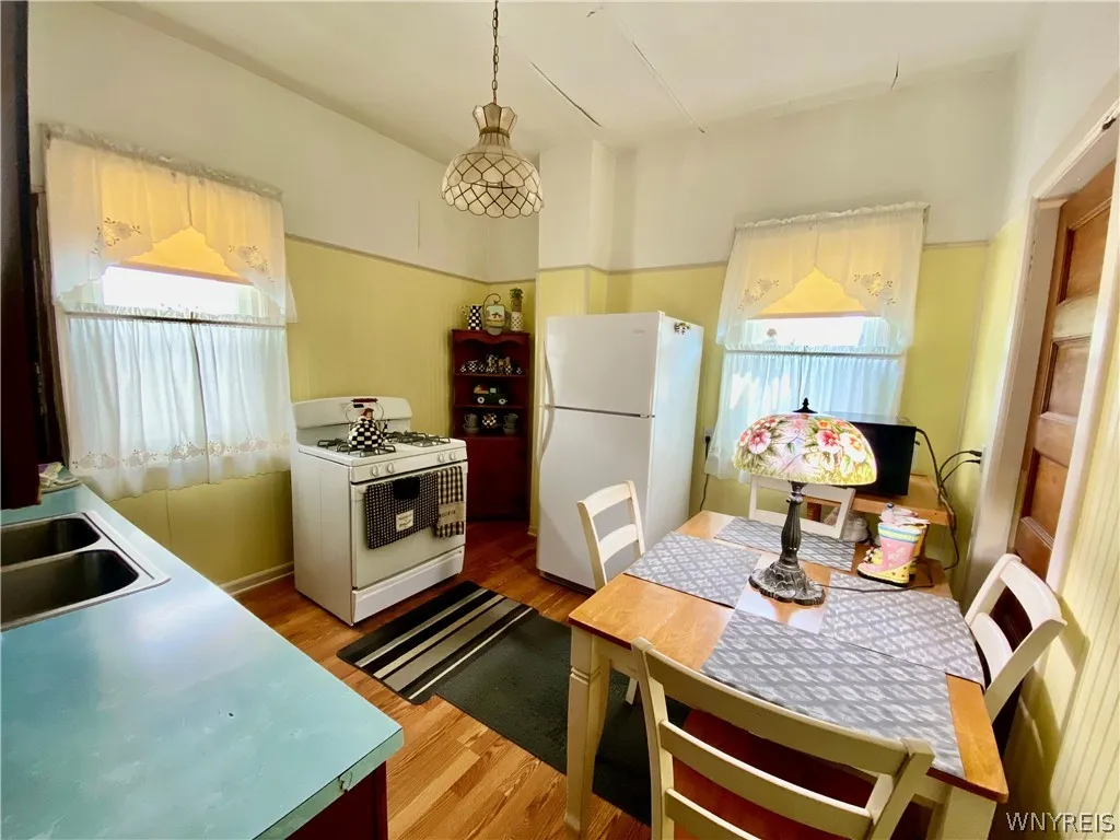 Kitchen has laminate flooring.  Appliances are included in "As-Is" condition.