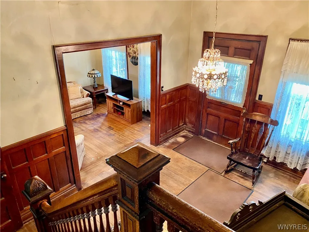 View of foyer and living room from stairway.