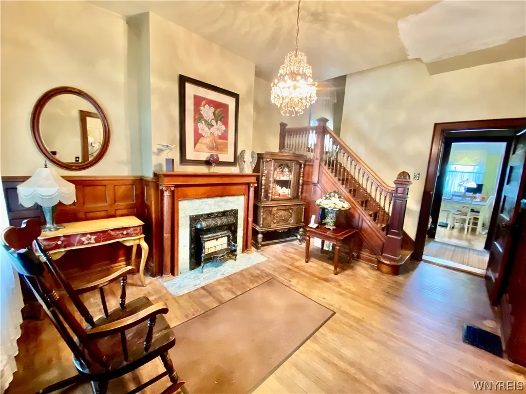 Grand foyer with decorative fireplace.