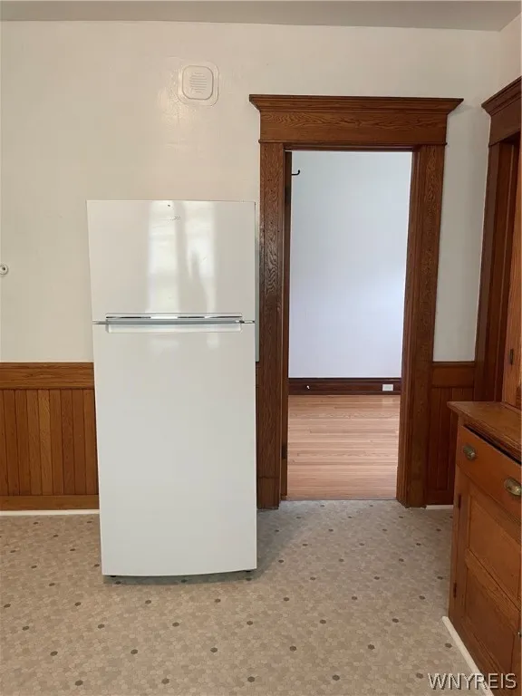 Newer fridge and view into den
