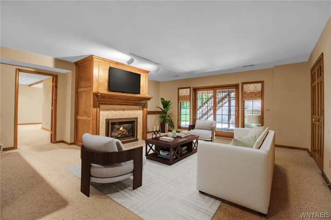 Lower level sitting area has been virtually staged