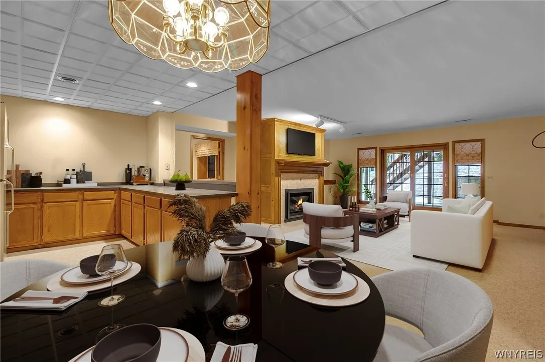 Lower level dining area has been virtually staged