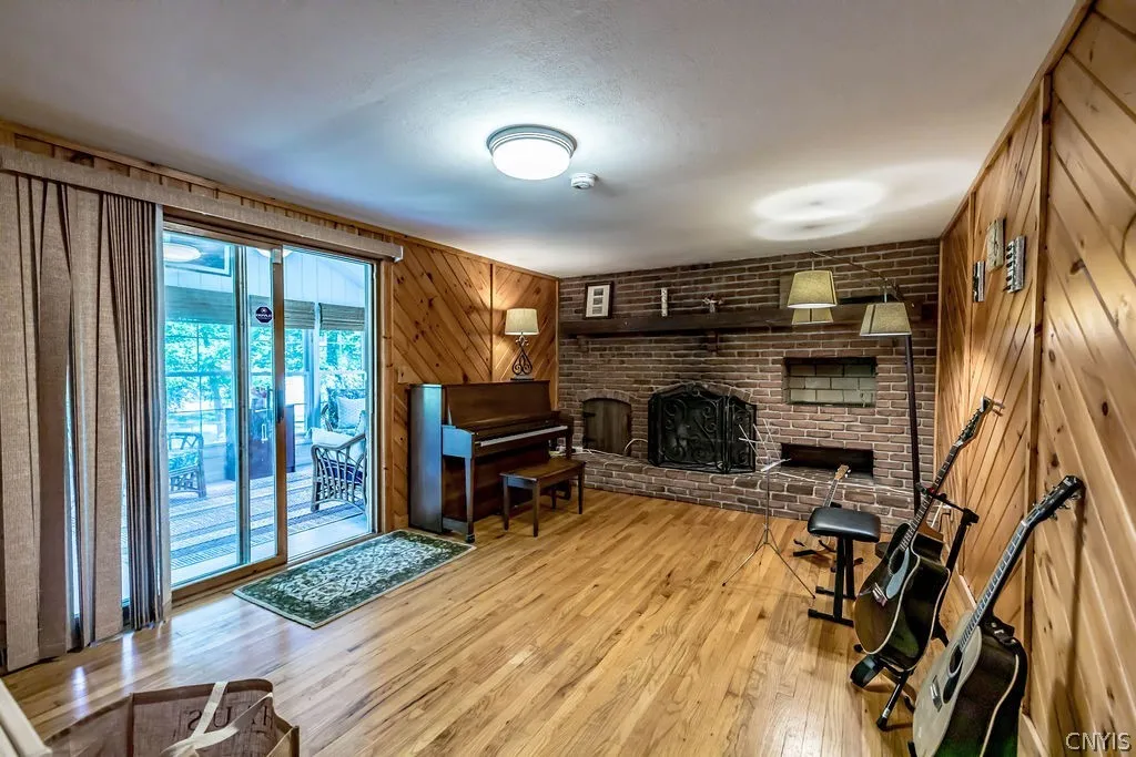 Sliding doors off the family room lead you to the generous 3 season enclosed porch, patio and pastoral backyard.