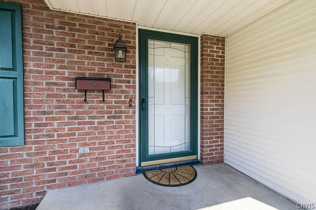 The central covered entry has brick accents accents.