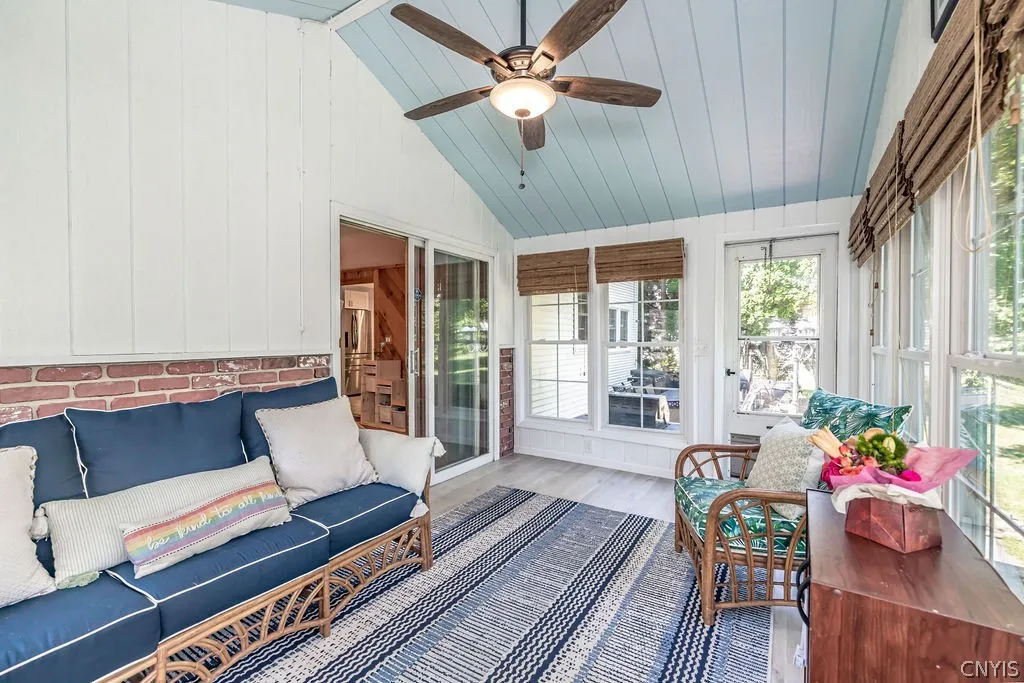 The recently redone porch features lots of windows to enjoy the patio and backyard views.