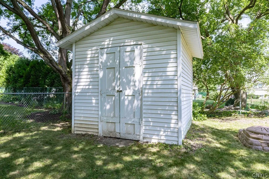 A handy shed stores all the backyard toys and lawn equipment.