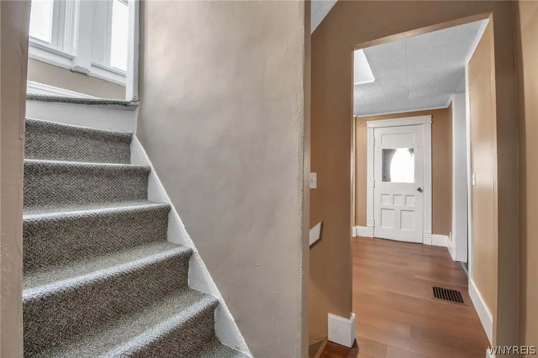 Double staircase off kitchen