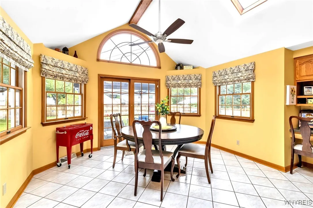 Lovely windowed views in KIT dining area with beamed cath ceiling,2 skylights, ceiling fan+ pretty chandelier