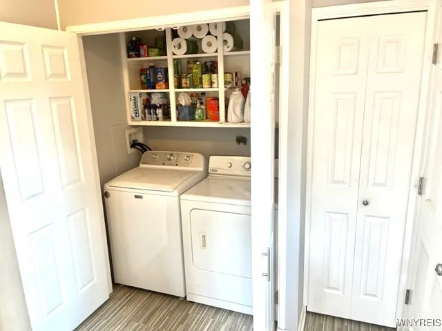 Laundry: Washer ('24)+ Dryer/storage shelves. Closet with bifold door