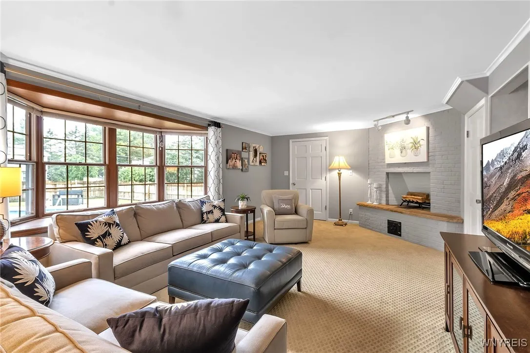 Family Rm with fireplace+ bay windowed views