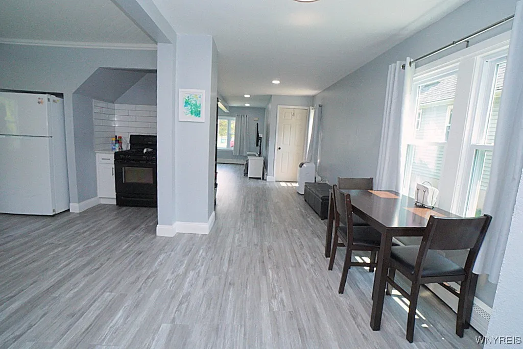 kitchen entrance to the left of dining area
