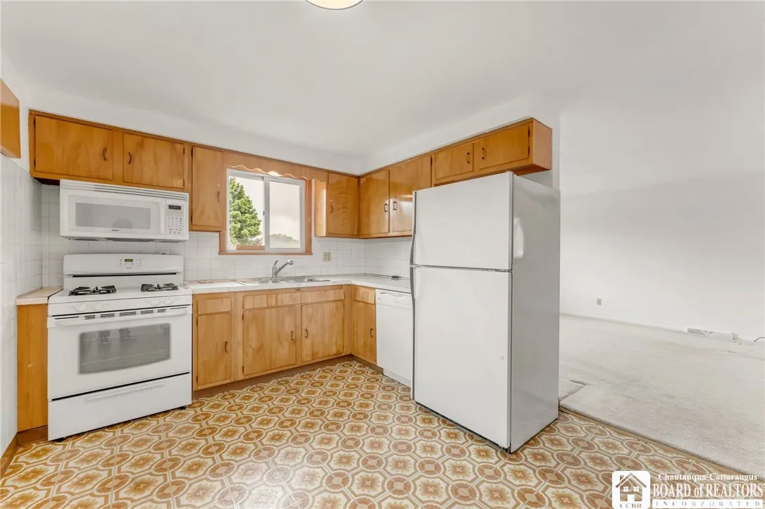 Kitchen opens to living/dining rooms.