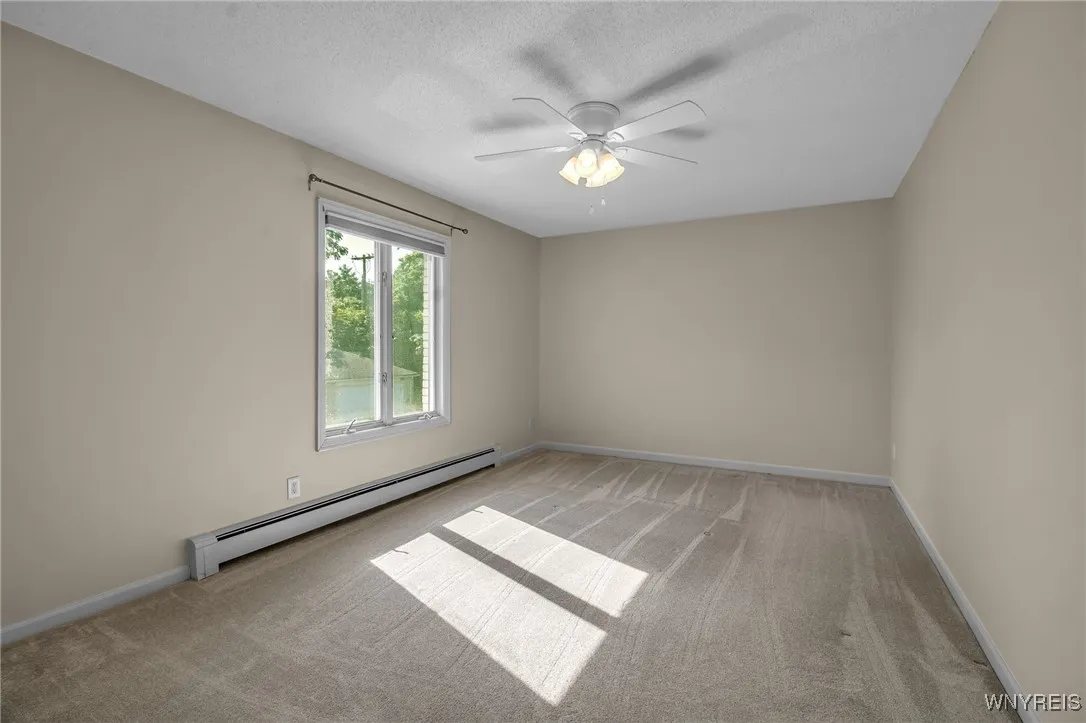 Large Primary Bedroom with newer carpeting...