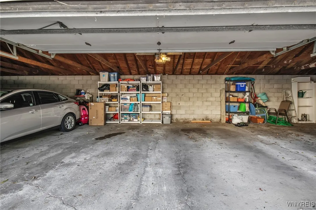 Plenty of space -- space to the right is for this unit.  There is room for storage shelving in front of the car...