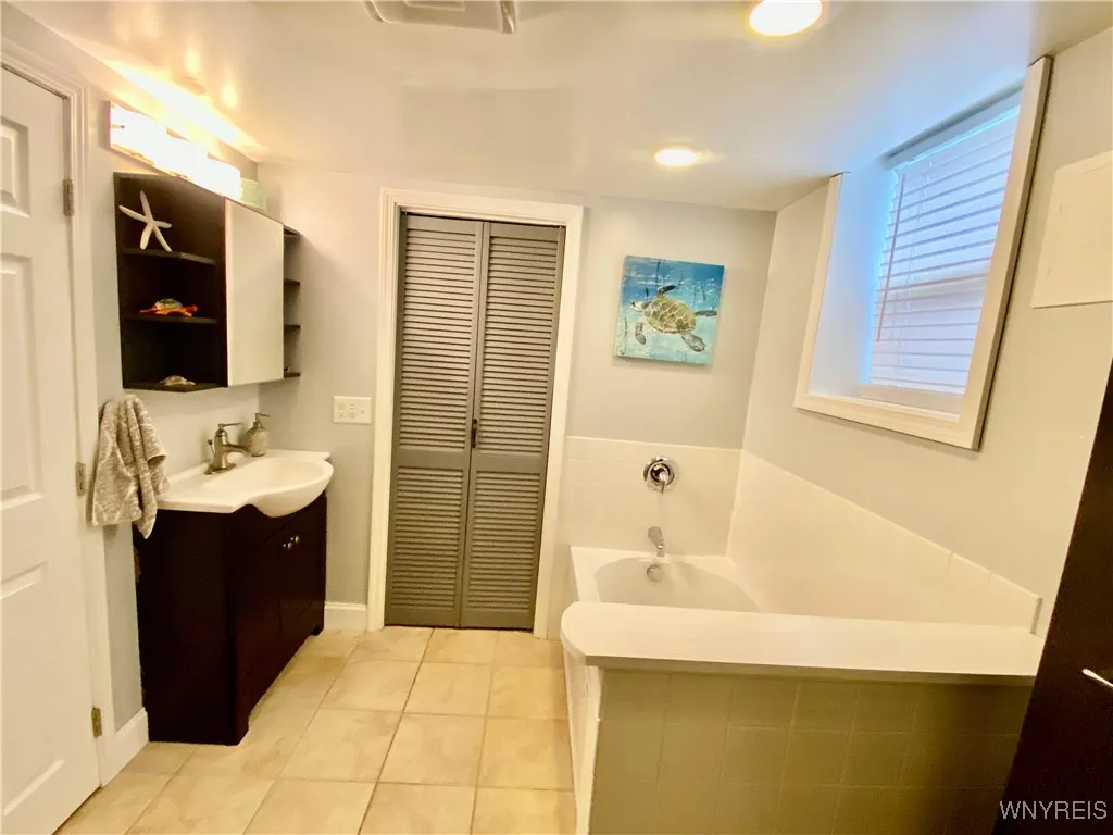 Laundry room behind the closet doors.
