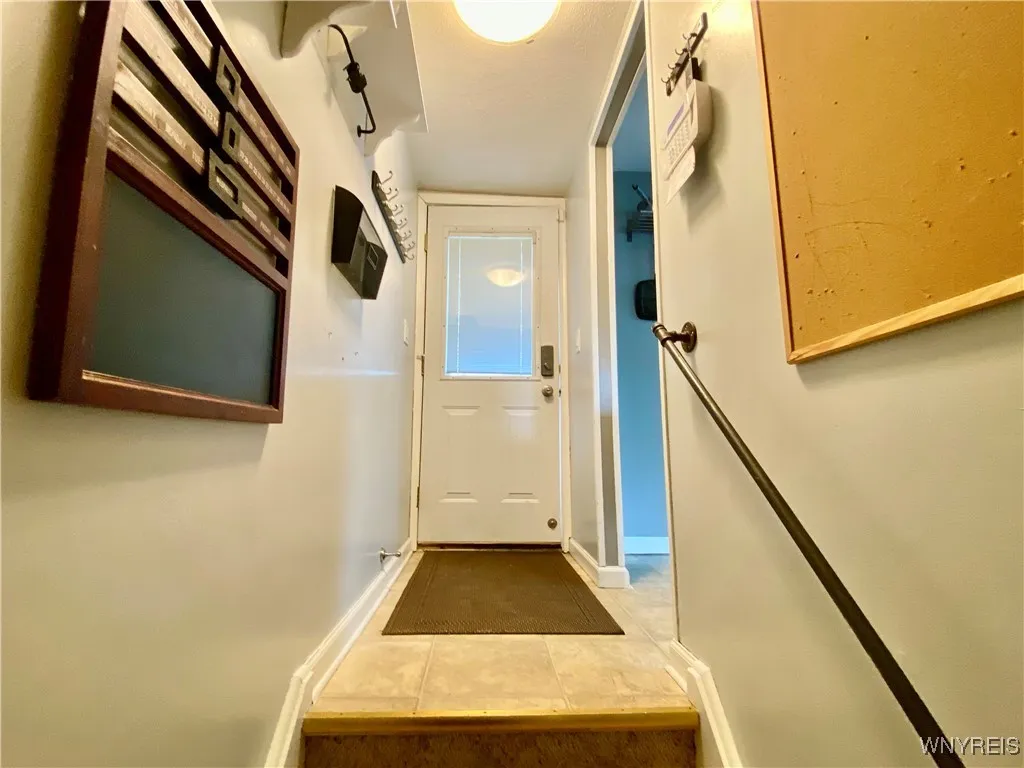 View of back door from lower level stairs.