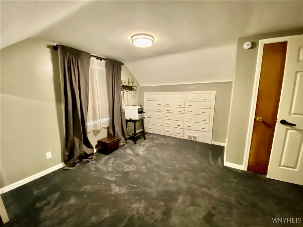 Built-in drawers offer great storage in this 3rd level bedroom.