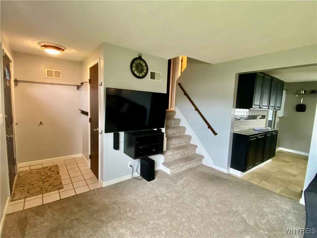 Coat closest in the foyer when you 1st enter through the front door.  Stairs to the 2nd level from the living room.