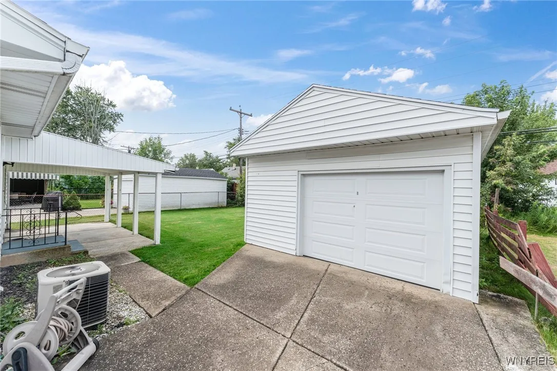 1.5 car garage with rear covered patio perfect for rainy days or just a little shade.