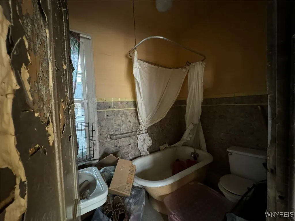 Bathroom is located from the kitchen