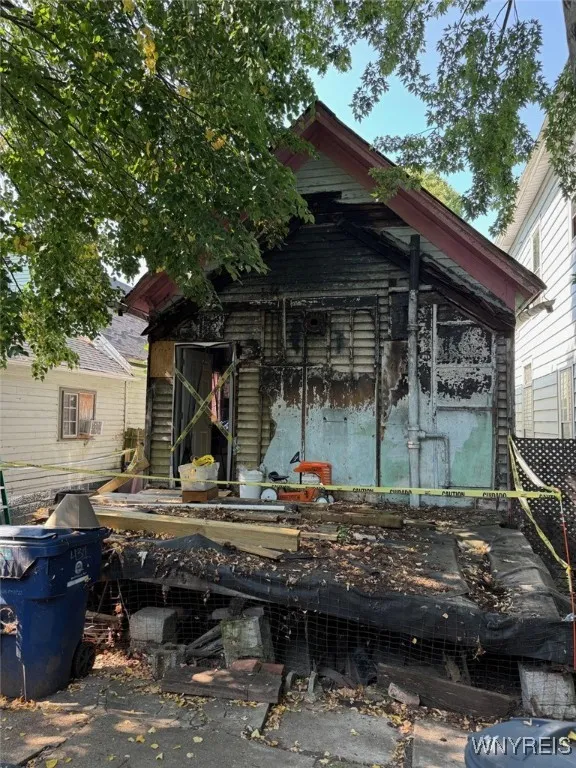 Back of the house. Please obey caution tape